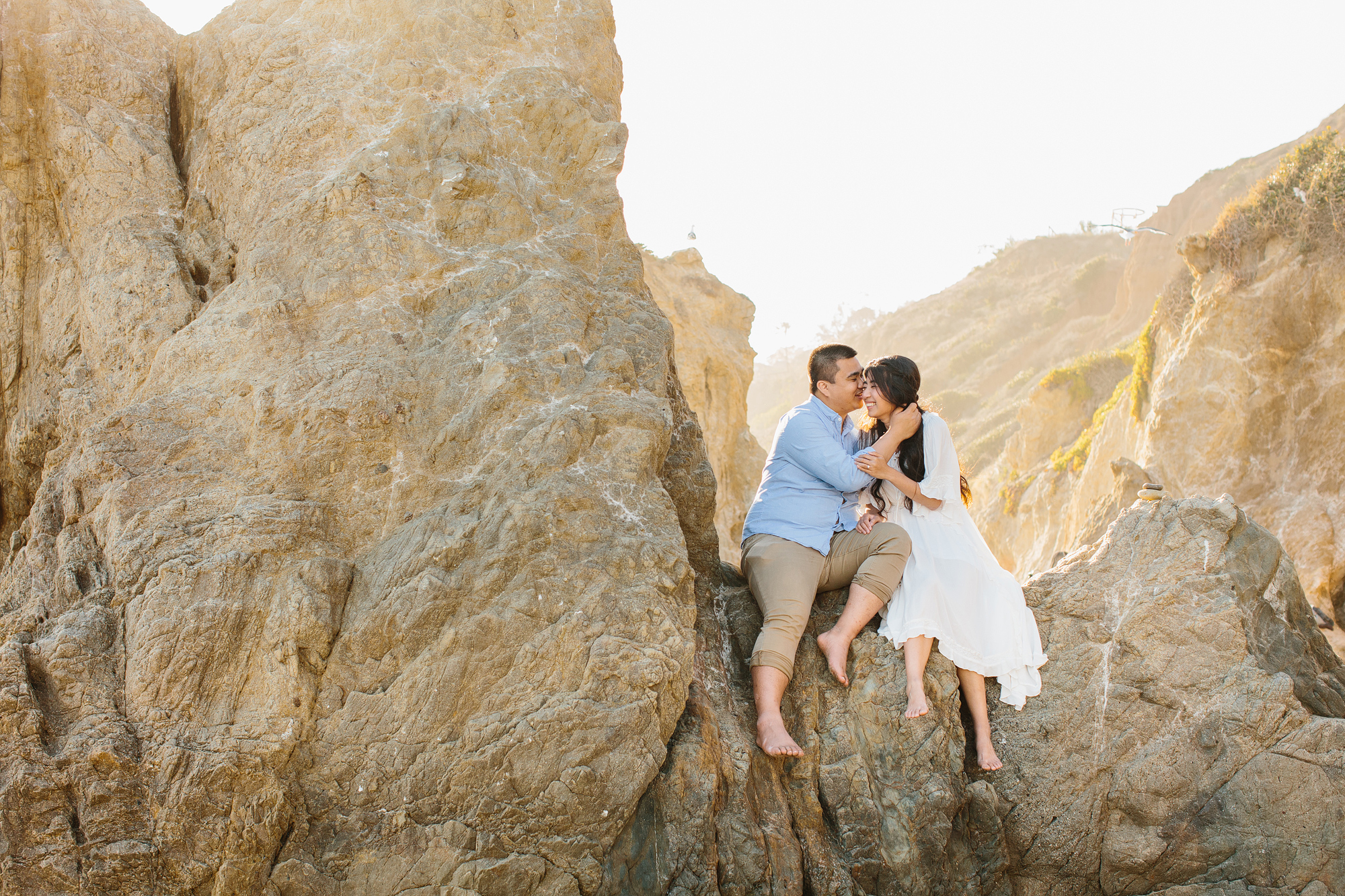 engaged couple at the beach in california