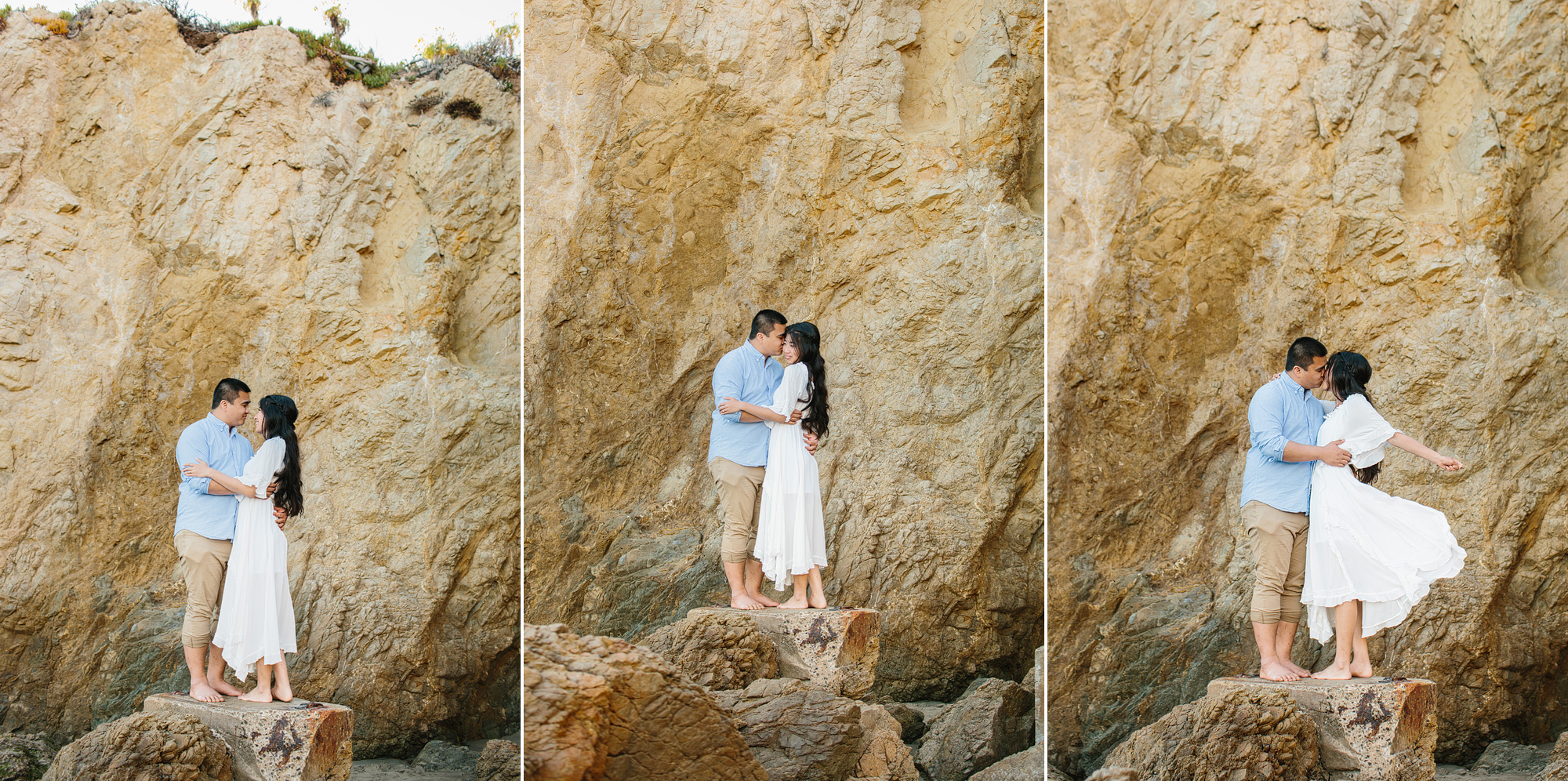 couple standing on rock at their engagement photo session